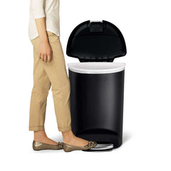 50L semi-round plastic pedal bin - black - lifestyle foot on pedal image