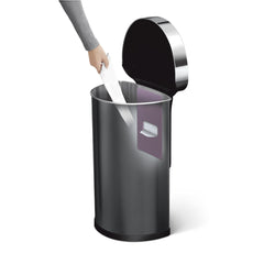 45L semi-round sensor bin - black finish - hand taking liner out of liner pocket